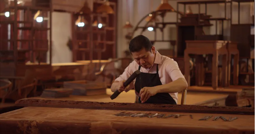 Huang Fuhua working at the Sanfu Redwood Furniture Factory, Xianyou, Fujian