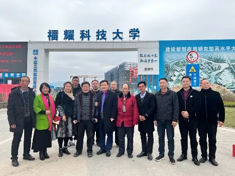 RongBin Zhu and Mingping Huang at Fuyao University of Science and Technology with Cao Dewang