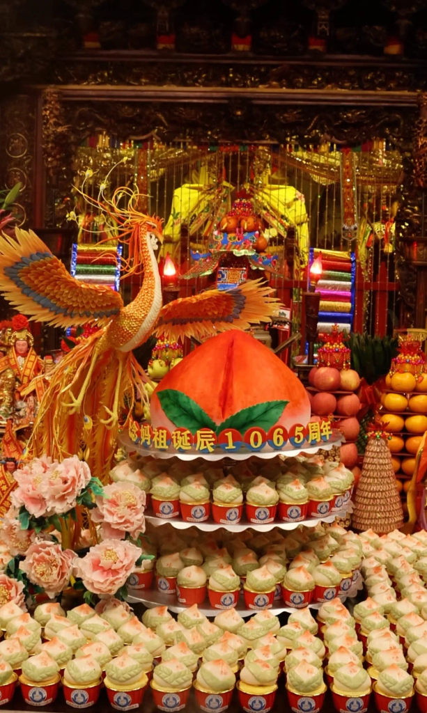 Mazu statue with a backdrop of Meizhou Island